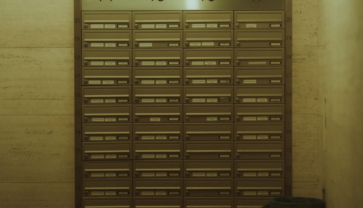 Mailboxes numbered fourteen through seventeen in a hallway