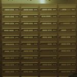 Mailboxes numbered fourteen through seventeen in a hallway